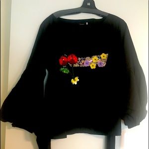 Black long sleeve top with appliqué